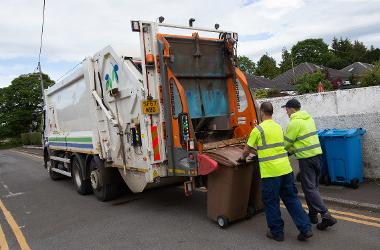 Refuse collectors loading brown bins